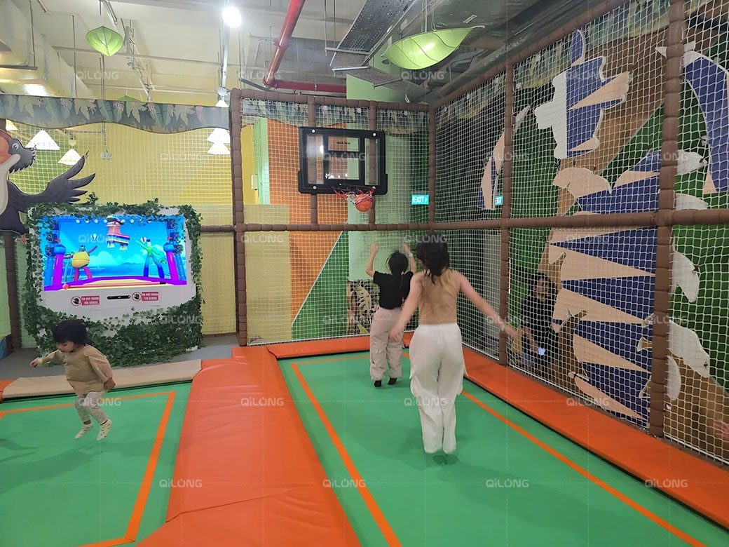 indoor trampoline park with basketball
